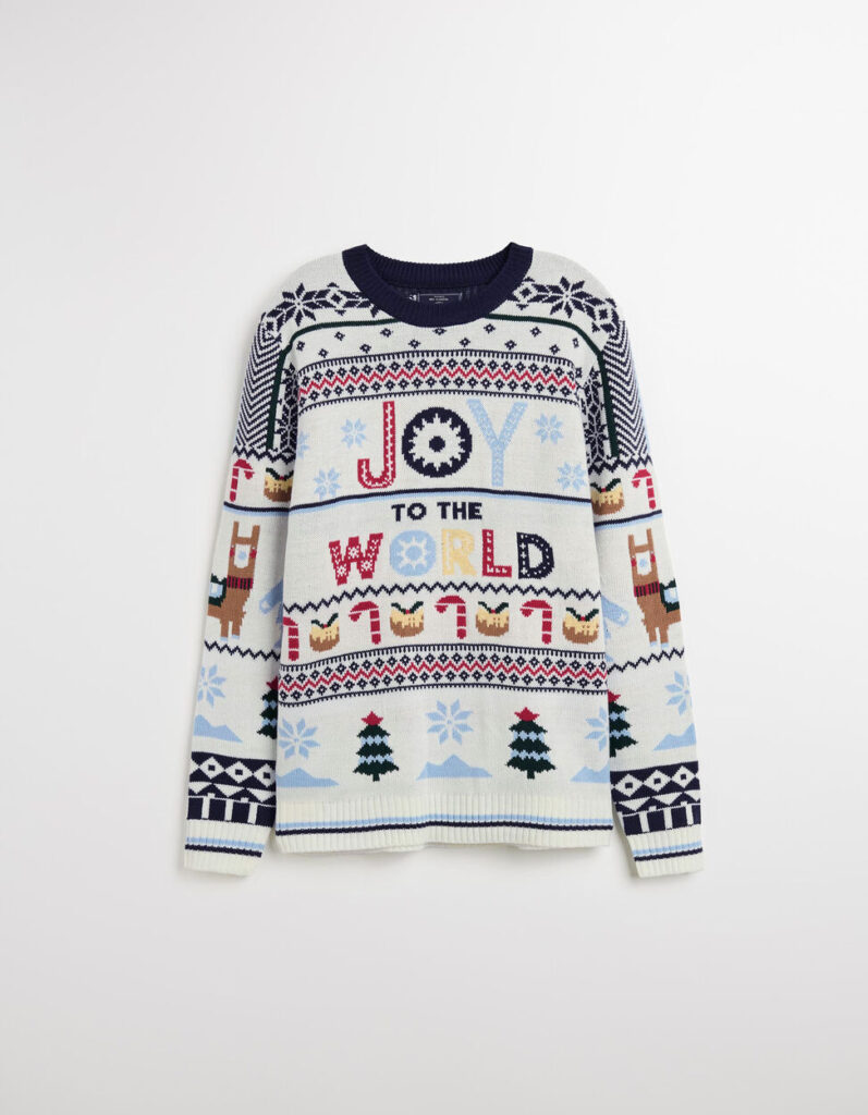 Camisola natalícia com padrão festivo e mensagem "Joy to the World".