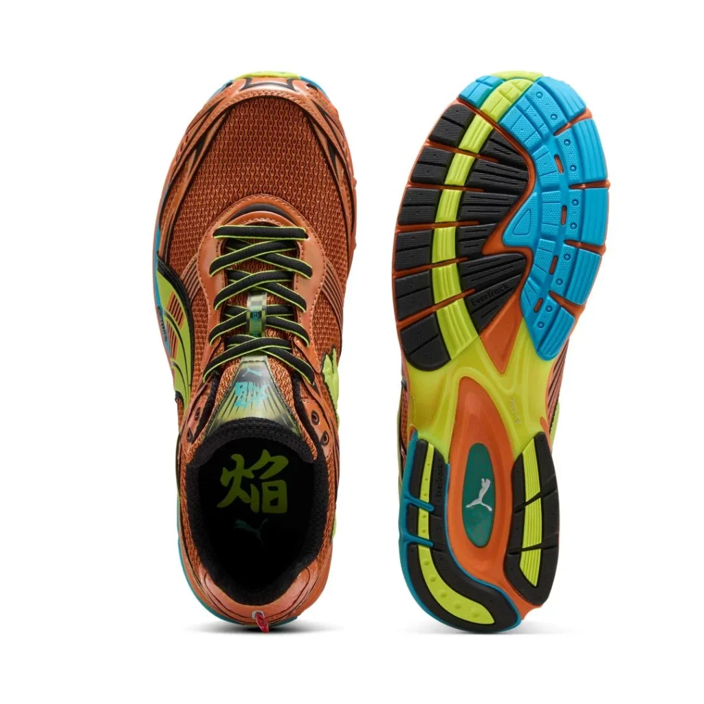 Ténis de corrida Puma em cor de laranja e verde.
