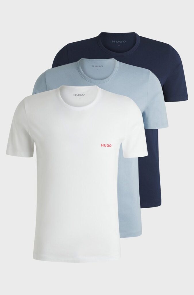 Três camisolas Hugo Boss: branca, azul e marinho.