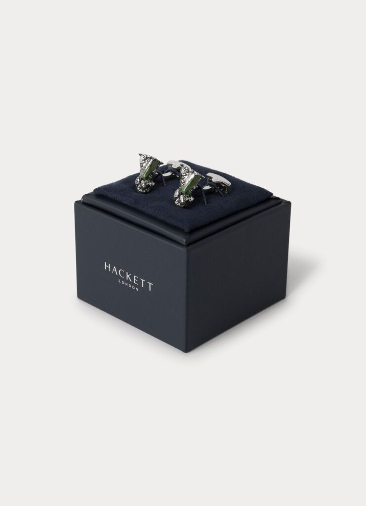 Botões de punho prateados sobre caixa Hackett