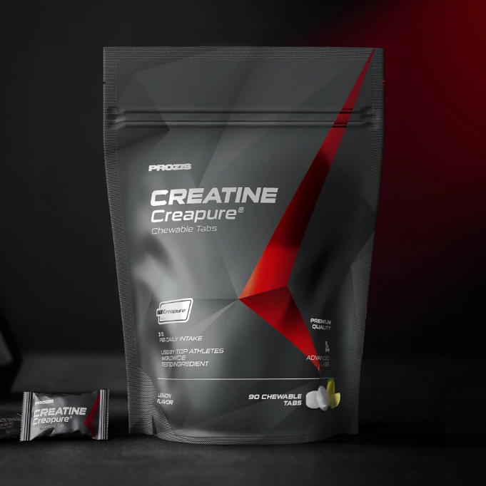 Embalagem de suplemento Creatine Creapure mastigável da Prozis em fundo escuro.