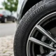 Close-up of Bridgestone tire on a car with alloy wheel