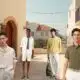 Homens em roupas casuais em zona urbana mediterrânica.
